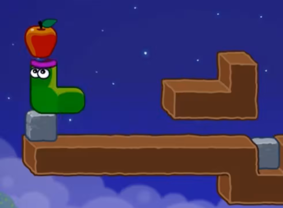 Apple Worm Level 16 Step 5: Move the left block and use the stack to reach the apple
