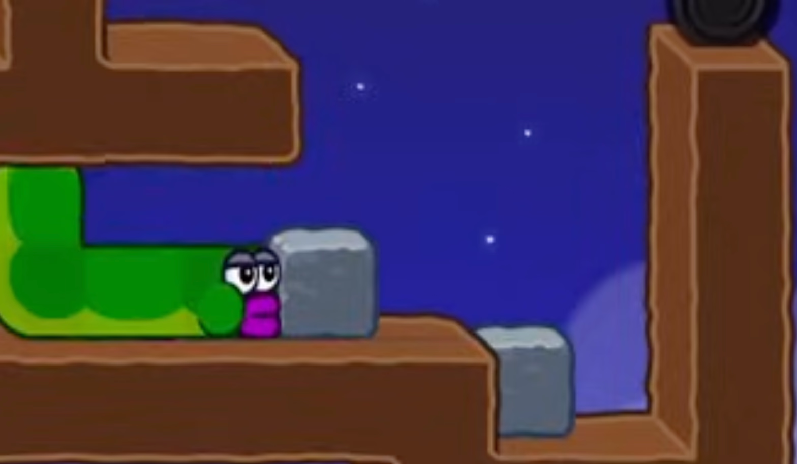 Apple Worm Level 20 Step 16: Push the left stone right to drop it into the pit, then climb up and clear the level